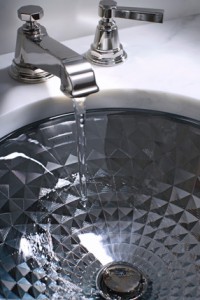 a sink with water flowing from faucet
